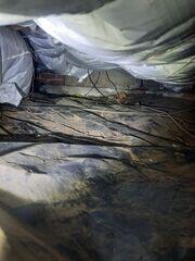 Full of debris and a damaged vapor barrier that was not properly protecting the crawl space.