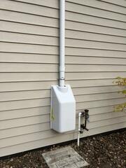 The fan outside of the home to expel the radon gas