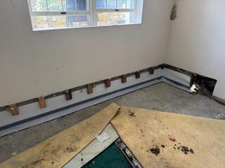 Step 4: We then covered the tops of the drains with a waterproof tape. This tape will prevent moisture transference from the drainage system to the concrete we poured over top, (as seen in the next photo).