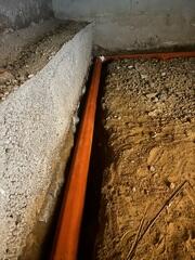 Starpipe was installed around the perimeter of the crawl space to collect groundwater and direct it to the sump pump for removal.