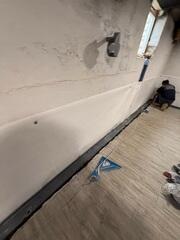 WaterGuard was installed around the perimeter of the basement to direct any seepage to the sump pump for removal.