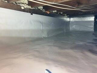 SilverGlo was placed on the walls to help insulate. Drainage matting was placed down to move any standing water to the perimeter drains. CleanSpace was used to encapsulate keeping out moisture, odors and humidity.