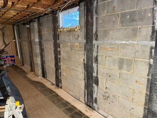 CarbonArmor straps installed along the bowing foundation wall, providing strong, permanent stabilization without intrusive excavation.