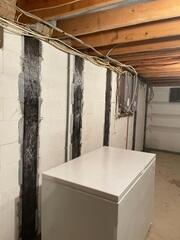 CarbonArmor straps installed along the cinderblock walls before Foamax wall liners were added to provide structural reinforcement.