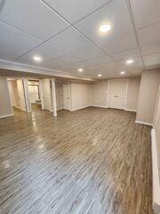 Used to add a stylish, wood-like finish without the risk of warping or water damage, our ThermalDry Elite Flooring creates a warm, inviting space while offering superior protection against basement moisture.