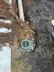 LawnScape was installed on the lawn as an outlet for the flooding from the basement, installed far from the home's foundation to prevent structural issues.