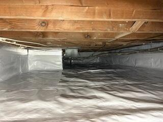 We installed our CleanSpace Vapor Barrier to fully encapsulate the crawl space and block ground moisture, preventing water vapor from entering and reducing the risk of mold and wood rot.
