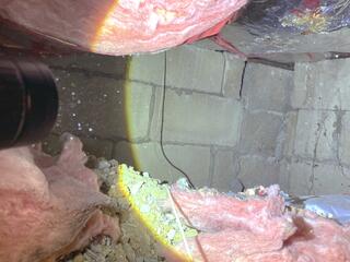 In addition to the porous walls, air is leaking through the unsealed and uninsulated rim joists and sill plates.