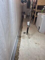 During: Our Foreman, Chris, and his crew secured numerous waterproofing products in the basement.