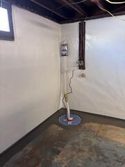 The newly installed SuperSump system, providing reliable water removal and protecting the basement from future groundwater intrusion.