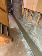 The WaterGuard Drainage System was installed to capture and redirect water at the foundation perimeter before it could seep into the basement and cause further moisture damage.