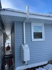 After: Jackson successfully installed the Radon Mitigation System, and the homeowner was delighted by the work completed.