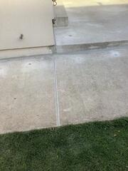 By lifting these side walkway slabs, we eliminated tripping hazards and restored a safe path to the backyard. We then sealed the perimeter against the house to ensure water is directed away from the foundation.