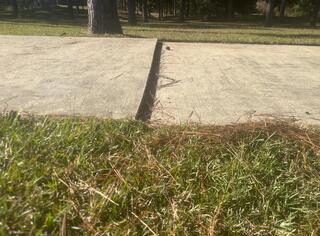 Driveway Before Image 2, you can see how much settlement has occurred and the large tripping hazard that formed.