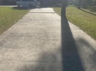 Driveway Before Image 3, a broader view, also showing the tripping hazard.