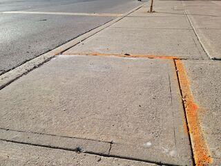The completed sidewalk restoration. The trip hazard is fully mitigated and the walkway is restored to a safe, level condition, allowing immediate access for patrons without the need for costly concrete replacement.