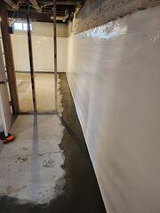 After: Our Foreman, Arturo, and his crew successfully secured all the waterproofing products throughout the basement.