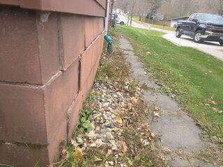 Before: The homeowner was concerned that their foundation wall was suffering from serious settling.