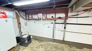 WaterGuard is an interior perimeter drainage system that captures water from basement walls and floors and channels it safely to a sump pump, keeping the basement dry even during heavy rainfall.