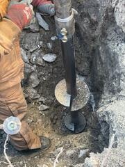 During: Our Foreman, Gabriel, and his crew replaced the struggling post with a Helical Pier.
