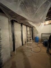 Bowing Walls in the basement were repaired with carbon straps to stop the walls from moving