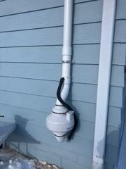 During: Our Foreman, Gus, and his crew secured a Radon Mitigation System along the south exterior wall.