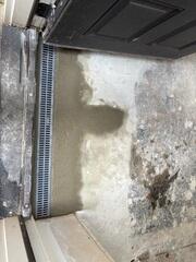 TrenchDrain is installed at key entry points to collect surface water before it spreads across the basement floor. It works alongside the drainage system to quickly channel water to the sump pump for removal.