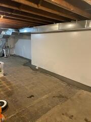 CleanSpace is a durable vapor barrier installed on basement walls to block moisture, odors, and humidity. It creates a cleaner, brighter environment while helping protect the basement from mold and damp conditions.