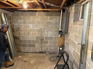 Before: Our Design Specialist, Dylan, recommended securing GeoLock Wall Anchors on the cracking and separating walls.