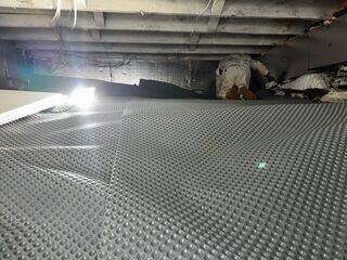 Drainage Matting was installed to provide a reliable pathway for water to move beneath the crawl space without accumulating on the surface.