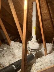 During: Our Foreman, Dakota, and his crew secured the Radon Mitigation System in the attic of the home.