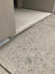 The entrance after the slab was stabilized and the premium sealant was applied. The gap is now fully protected, ensuring that moisture cannot penetrate the transition point even during heavy snow or rain.