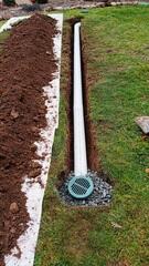 LawnScape discreetly releases sump pump water away from the foundation, blending into the yard while preventing erosion and water from cycling back toward the home.