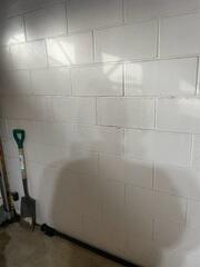 Before: Our Design Specialist, Ryan, inspected the cracked, damaged walls.