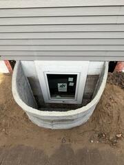 During: Our Foreman, Aaron, and his crew secured two egress windows on the struggling wall.