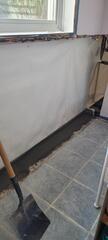 AFTER - We installed clean space vapor barrier and water guard subfloor drainage system