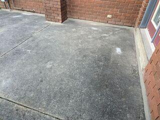 The finished entryway at this Wasaga Beach residence. With the slabs lifted and our premium sealant expertly applied, the walkway is now a clean, uniform surface. By sealing the junction where the concrete meets the brick, we've created a permanent "waterproof envelope" that protects the entrance from future soil erosion.