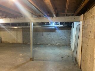 Before: Our Design Specialist, Mac, suggested waterproofing the entire basement.