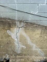 Before: Our Design Specialist, Kyle, recommended stabilizing the wall crack.