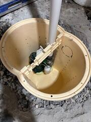 During: The crew took out the old sump pump and replaced it with the TripleSafe sump pump.