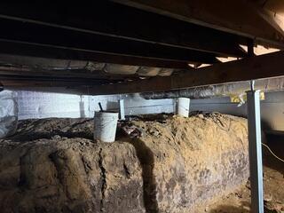 You can see the other SmartJack post we installed from this picture, found in the back of the photo.These posts were jacked up to level out the kitchen floors above.