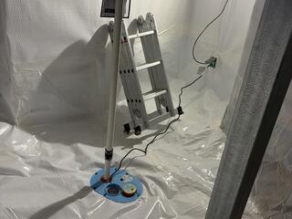 This photo shows our SmartSump sump pump. It has an airtight lid, and was designed to be fitted with our vapor barrier to create a seal. The sump pump also has an airtight floor drain and an alarm system to account for potential plumbing leaks in the space. All of our patented products serve a purpose, and they work in cohesion with one another.