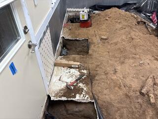 During: Our Foreman, Jesus, and his crew secured three Helical Piers along the struggling foundation.