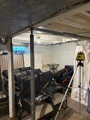 Before: Brian, one of our Design Specialists, recommended securing SmartJacks to stabilize the sagging floor.