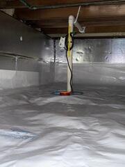 SmartSump was installed to actively manage and remove water that collects in the crawl space. Designed specifically for crawl spaces, this system efficiently captures groundwater and pumps it safely away from the foundation.