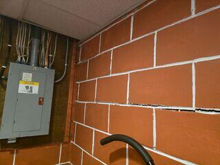 Before: Our Design Specialist, Darin, recommended repairing and stabilizing the damaged walls with PowerBraces.