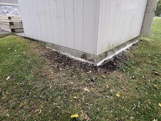 Reinforced & Level After our polyurethane injection, the voids are completely sealed. The concrete pad is back to its original height, and the perimeter has been tidied to ensure the shed sits on a firm, healthy base.