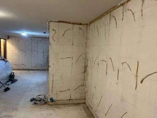 Before: Our Design Specialist, Dustin, recommended securing several waterproofing products throughout the basement.