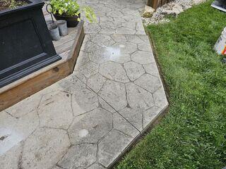 By leveling the sunken walkway, we eliminated the dangerous "lip" between the concrete and the wooden deck. The result is a smooth, hazard-free transition that protects the homeowners and restores the beauty of their backyard.