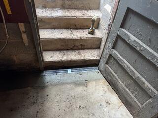 TrenchDrain was added at basement entry points to prevent surface water from entering the space.